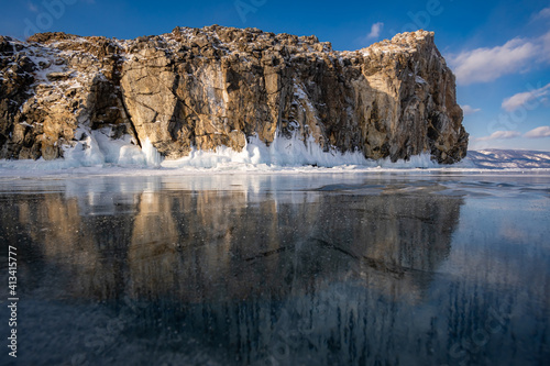 Reflection of rocks in the ice surface of Lake Baikal