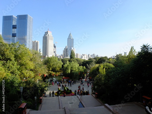 A summer day in Hongshan park with the skyline of Ürümqi in the background photo