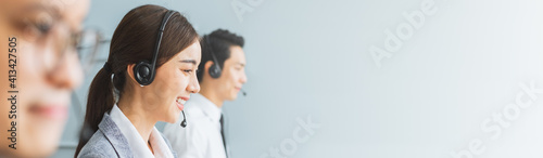 Banner Asian team call center, customer service, telesales in casual with headset or headphone and look at camera photo