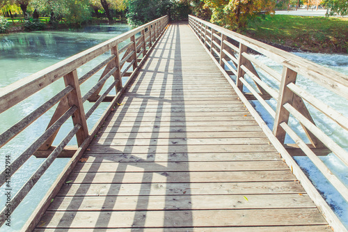 Wooden footbridge over the Pivka river in Slovenia