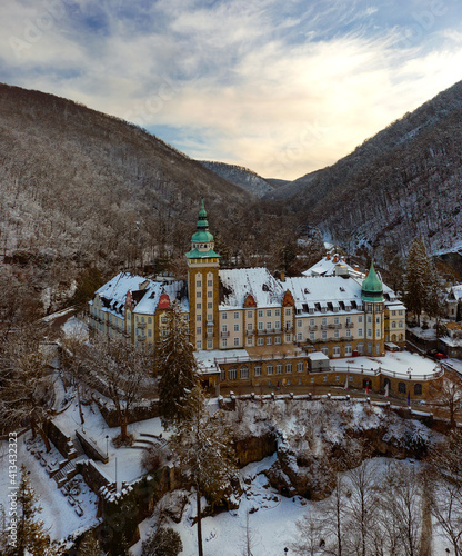 Hotel Palota in Lillafured, Miskolc on a snowy winter night. Castle building slightly covered with snow photo