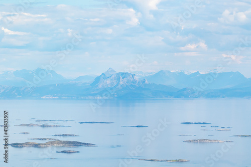 View of small islets and mountains seen far on the other side of the fjord in Norway