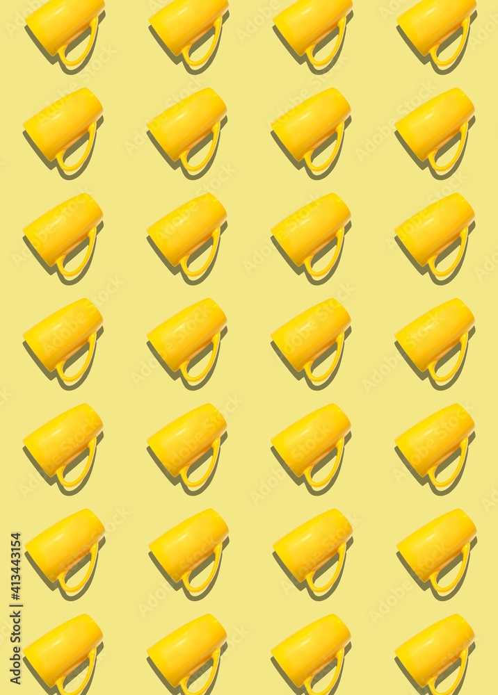 A pattern of yellow cups on a light yellow background. A pattern of yellow cups on a light yellow background.
