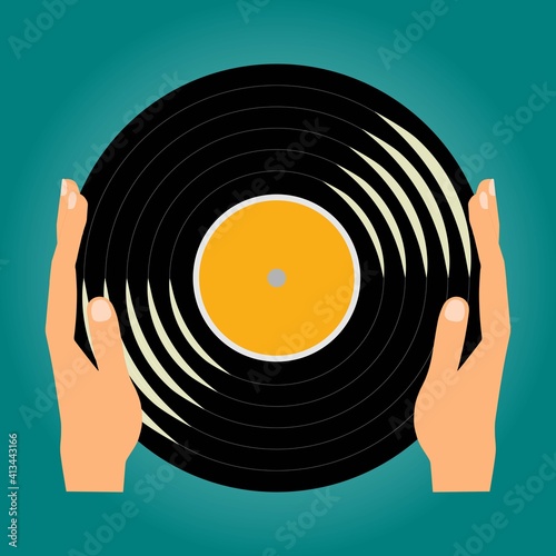 Hands holding a Vinyl music record 