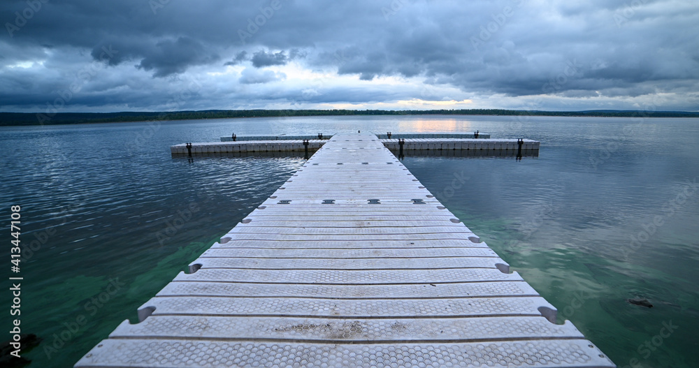 pier on the river, dramatic sky 