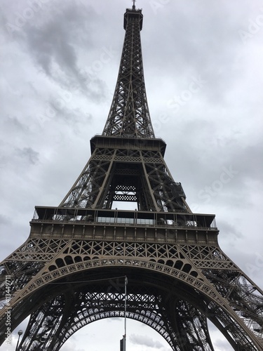 Low Angle View Of Eiffel Tower Against Cloudy Sky