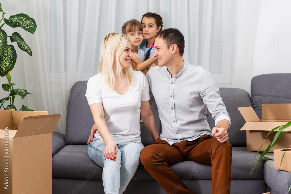 concept housing a young family. Mother father and children in new house concept housing a young family. Mother father and children in new house