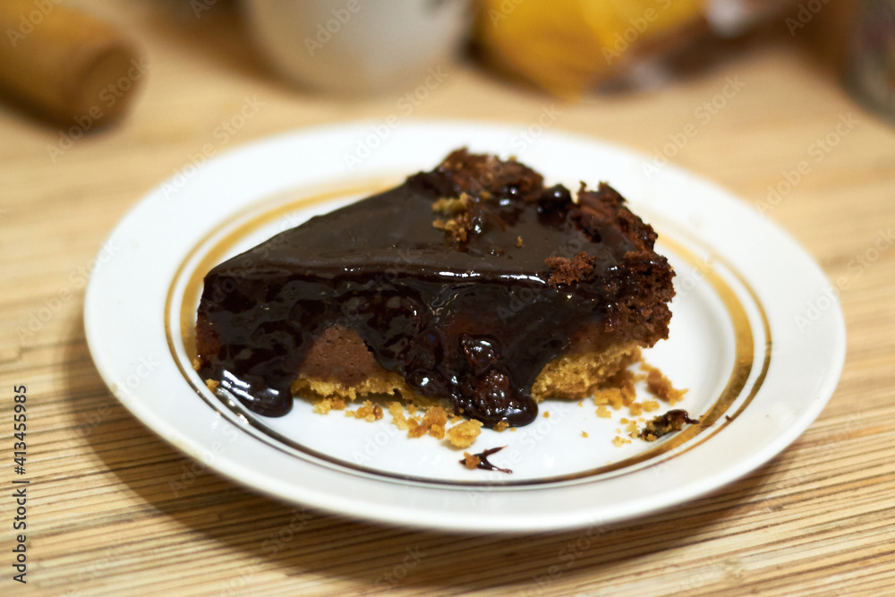 Chocolate cheesecake on a white plate Chocolate cheesecake on a white plate