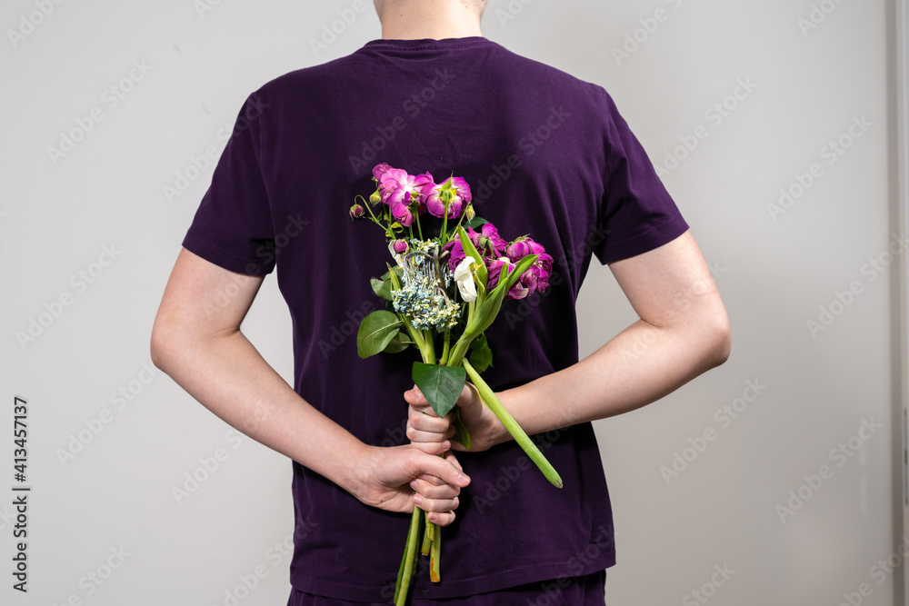 man is holding a bouquet of dead and withered flowers man is holding a bouquet of dead and withered flowers