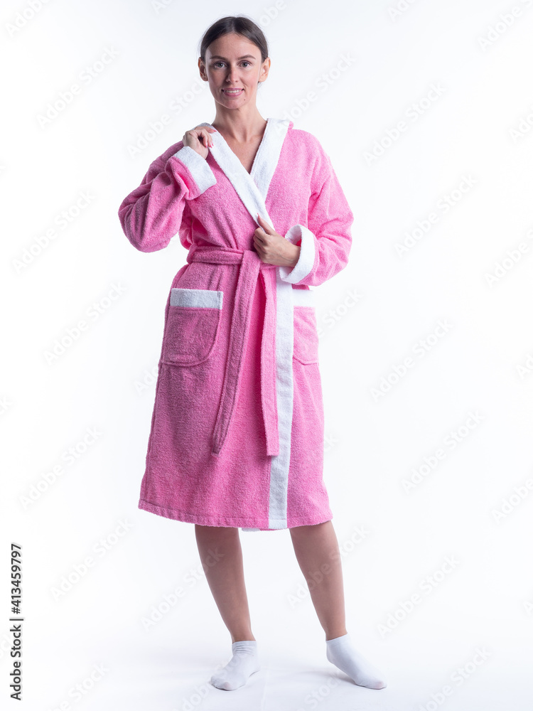 woman in a Bathrobe on an isolated white background with a smile on her face. woman in a Bathrobe on an isolated white background with a smile on her face.