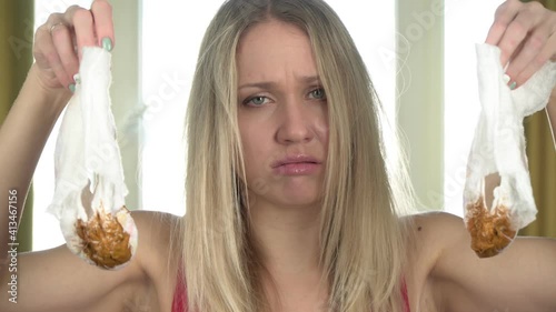 Young woman mother with dirty baby diaper, close-up