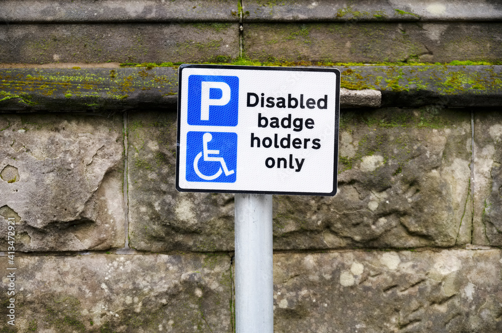 Disabled blue badge holder parking sign for driver Disabled blue badge holder parking sign for driver
