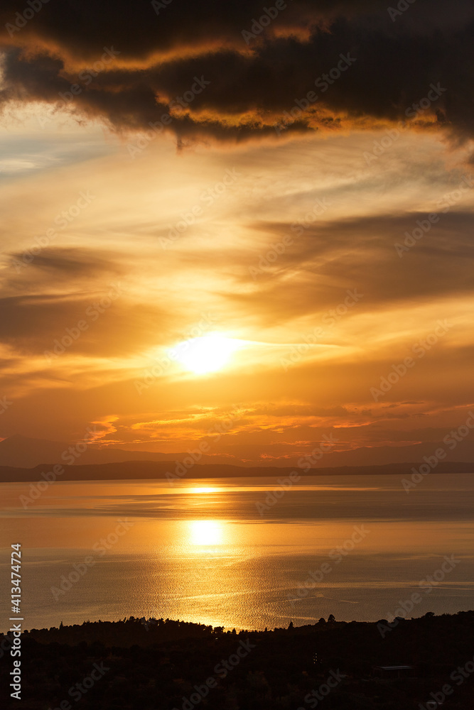 Fototapeta premium Golden sunset in Prathenonas, Sythonia with view to Cassandra - Halkidiki, Greece