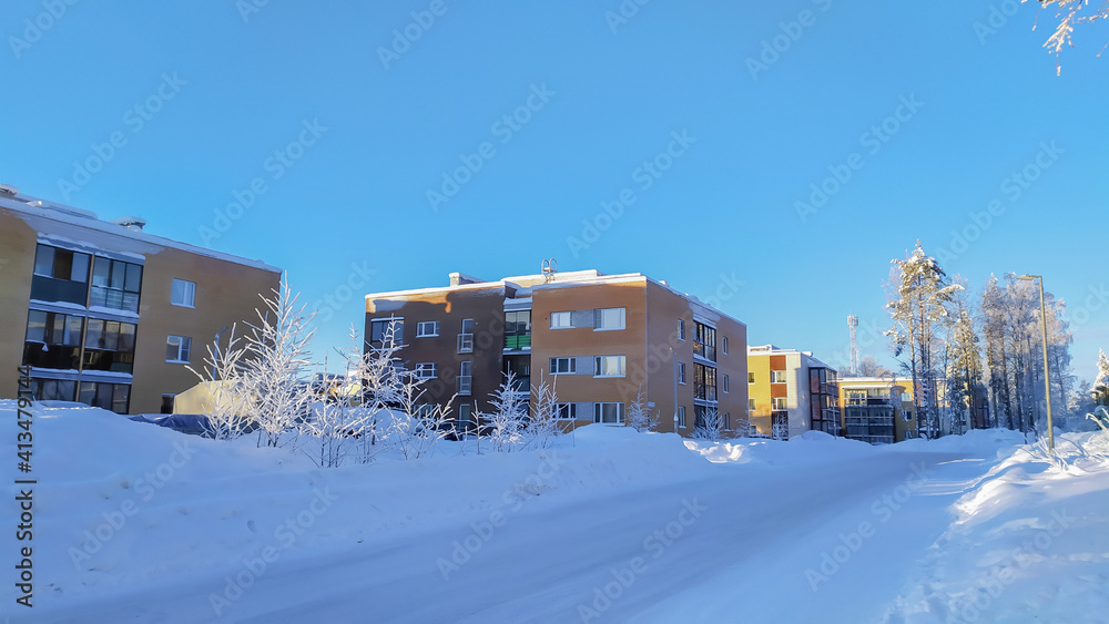 Russia,Republic of Karelia, Kostomuksha. Square colorful houses stand in a row.February 12, 2021.