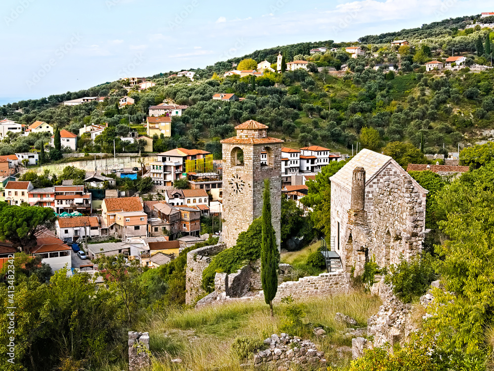 View of Stari Bar, a small town in Montenegro, with ruins, an old church tower and residential houses
