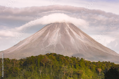 Landscape with the Arenal volcano which hangs over the lenticular cloud