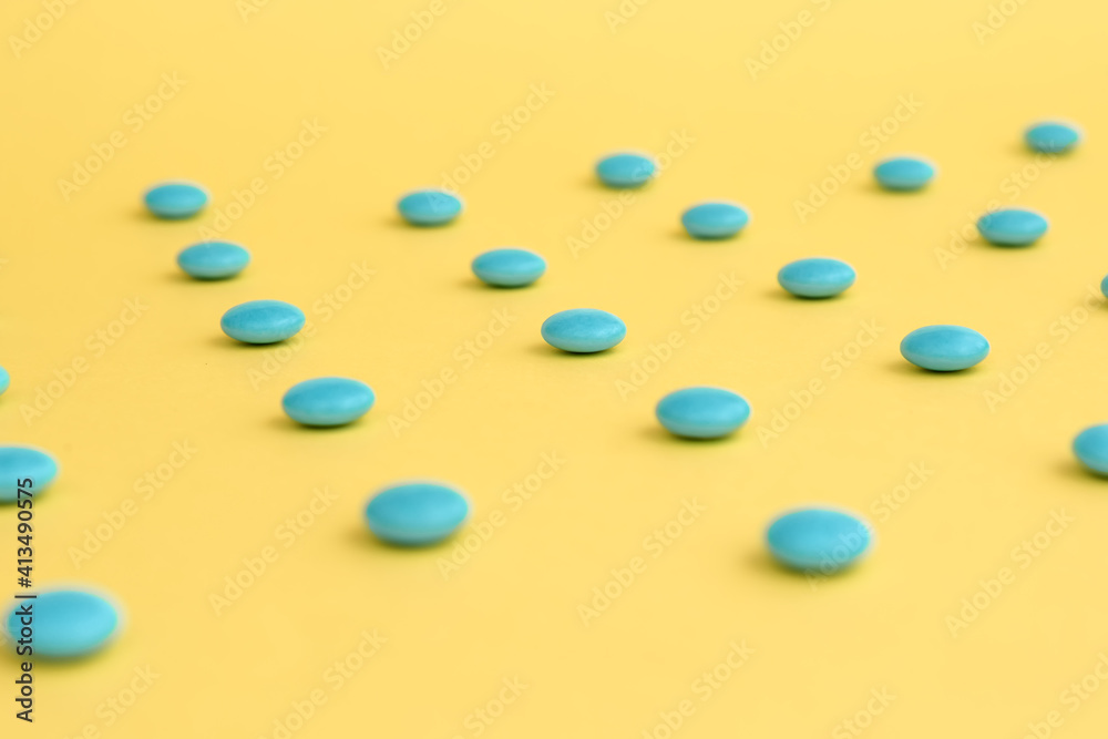 pattern blue pills on yellow background pattern blue pills on yellow background