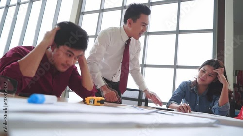 Angry Construction Boss is Mad, Yelling and shouting to employee in Engineer meeting table contractor office.