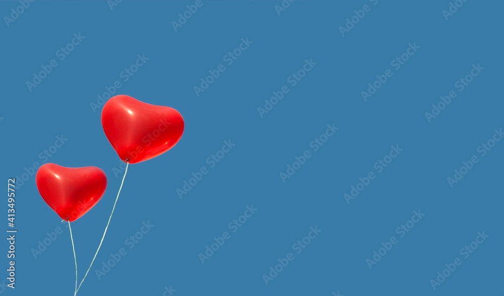 Banner with two red balloon in the blue sky