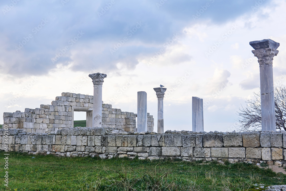 ruins of antique greek basilica with columns against a winter sky ruins of antique greek basilica with columns against a winter sky