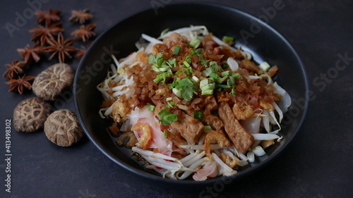 Rice flat noodle with dried shrimp, ground pork, squid, tofu and beansprout in sweet black soy sauce, Thai called Kuay Teow Lord