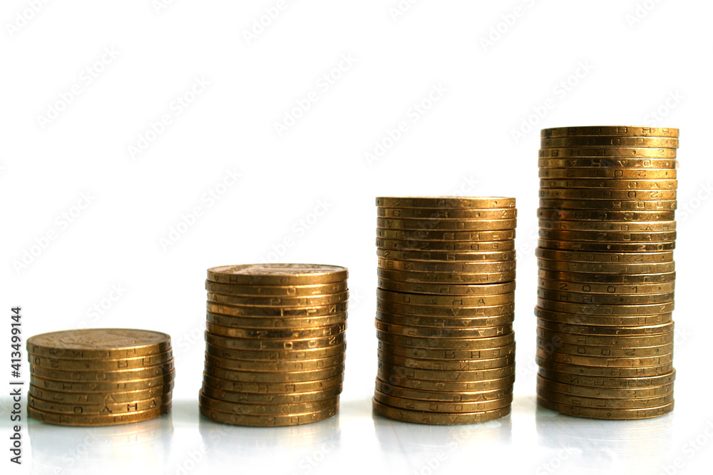 Four columns of coins on white background Four columns of coins on white background