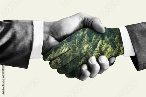 Green deal concept, handshake. Double exposure, hands with forest.