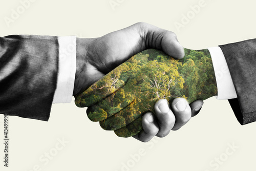 Green deal concept, handshake. Double exposure, hands with forest. photo