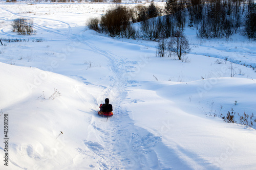 downhill skiing in winter on tubing