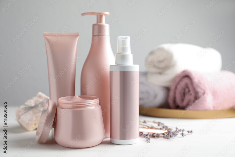 Set of hair care cosmetic products on white table. Space for text