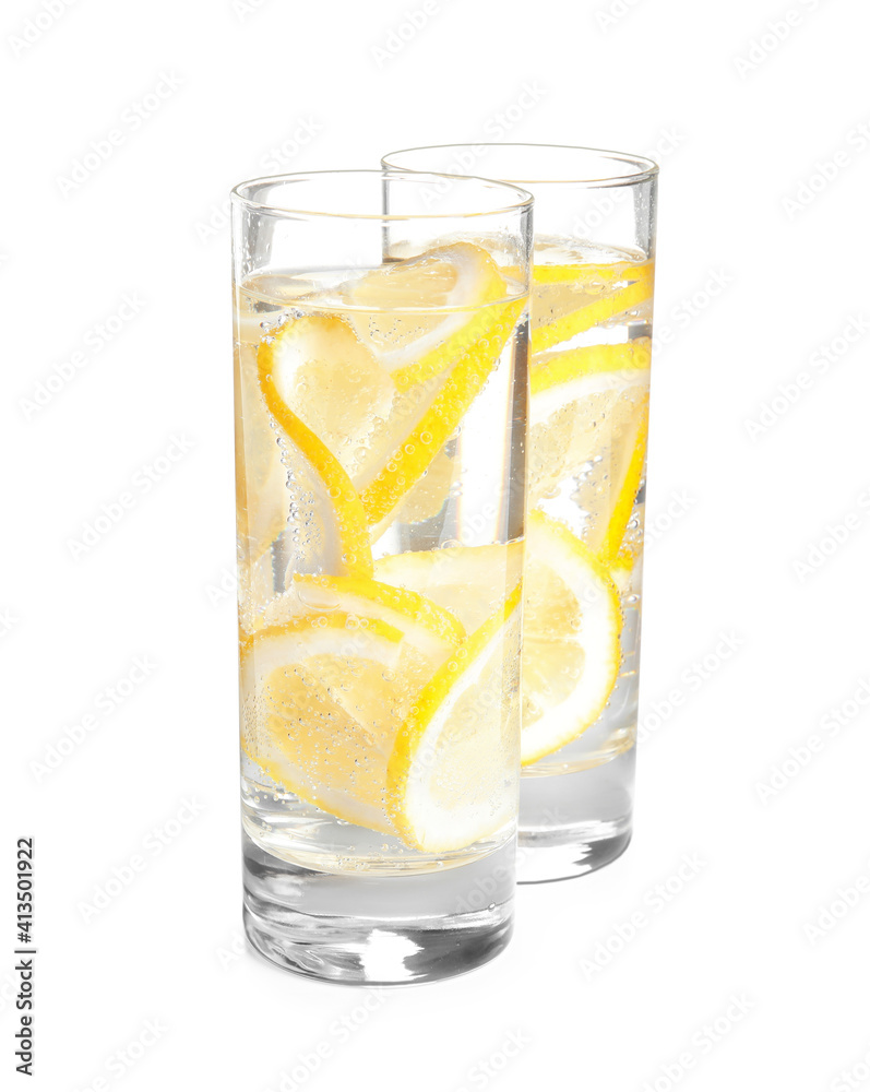 Soda water with lemon slices on white background Soda water with lemon slices on white background