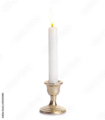 Glowing wax candle on white...