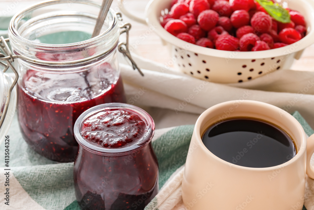Composition with sweet raspberry jam on table Composition with sweet raspberry jam on table
