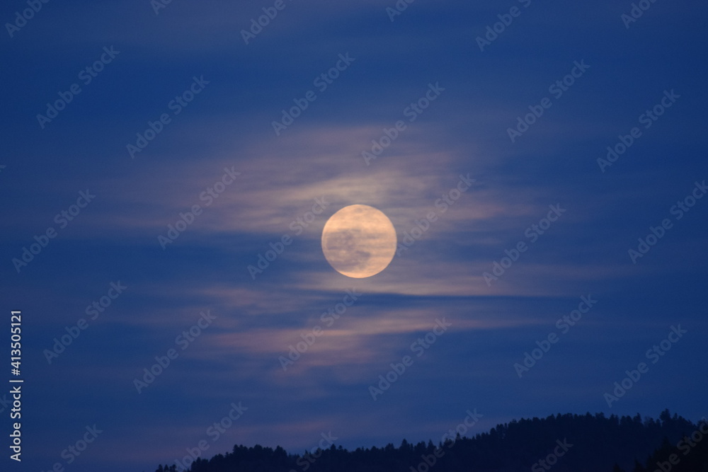 Full moon shinning through thin clouds Full moon shinning through thin clouds