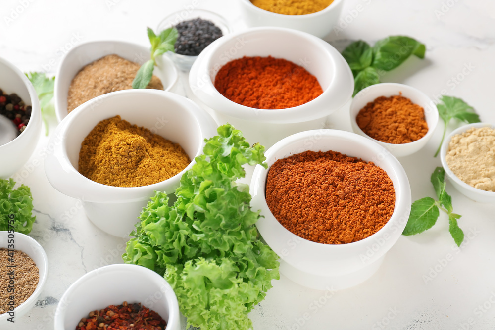 Bowls with different spices on light background Bowls with different spices on light background