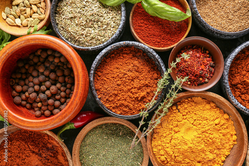 Fototapeta Naklejka Na Ścianę i Meble -  Bowls with different spices, closeup