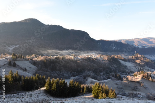 Frost covered mountain landscape on an early winter morning