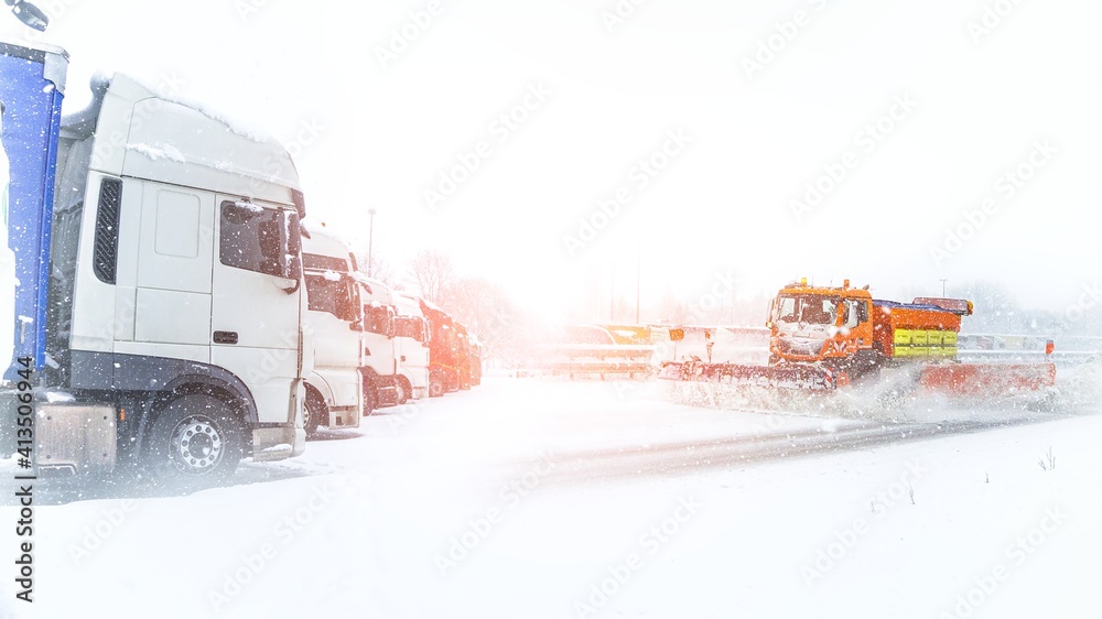 Winter service in action on the motorway ,heavy snow on the roads, a ban on driving