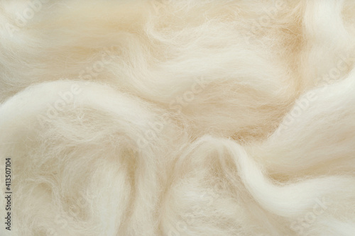 Soft white wool texture as background, closeup