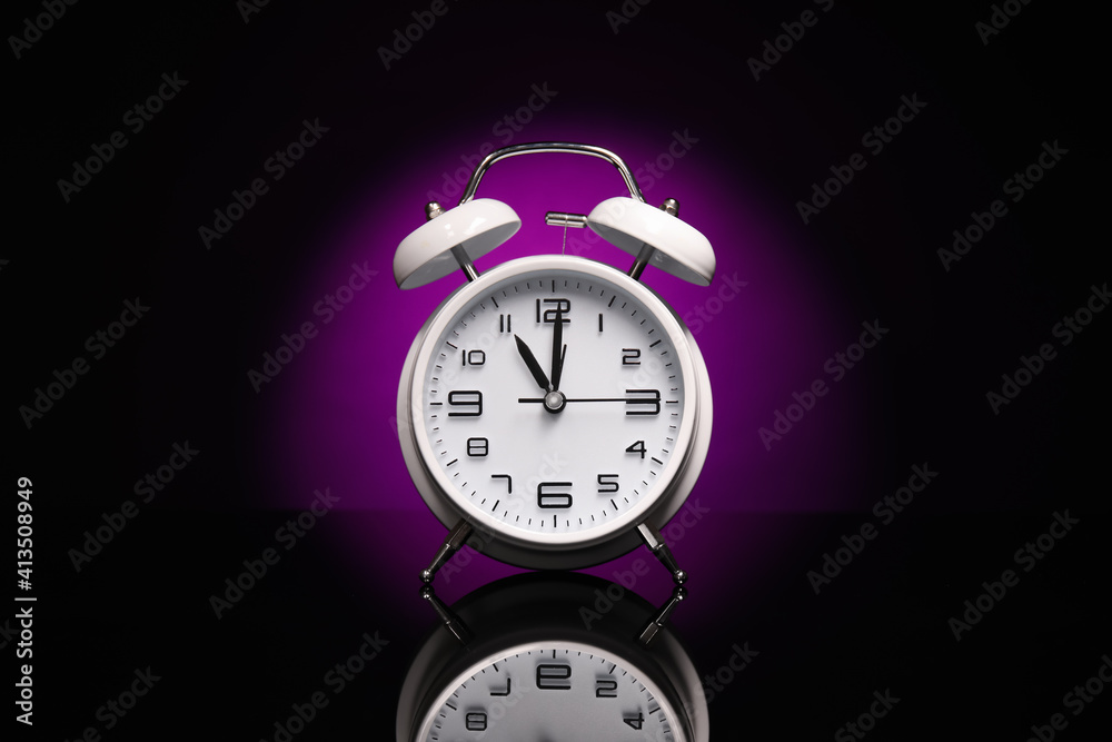 Alarm clock on black background Alarm clock on black background