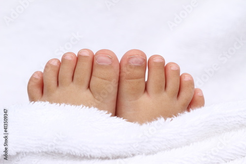 The little cute foot baby in soft blanket