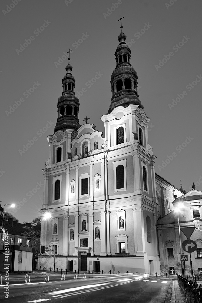 facade and bell towers of a baroque church during the night facade and bell towers of a baroque church during the night