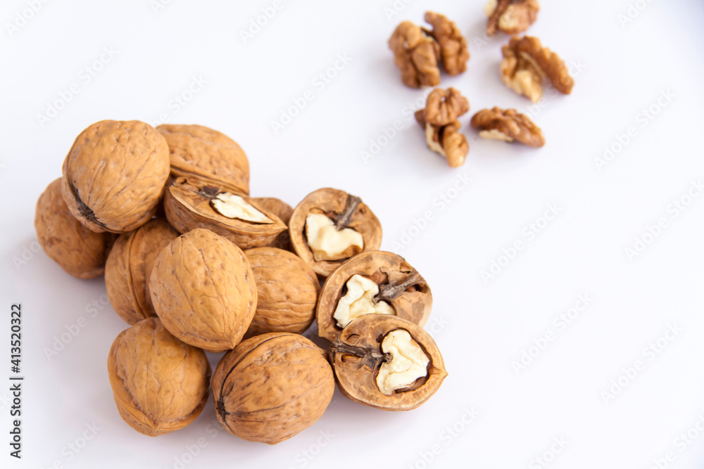 Walnuts in a shell on a white background. Healthy nuts. Walnuts in a shell on a white background. Healthy nuts.