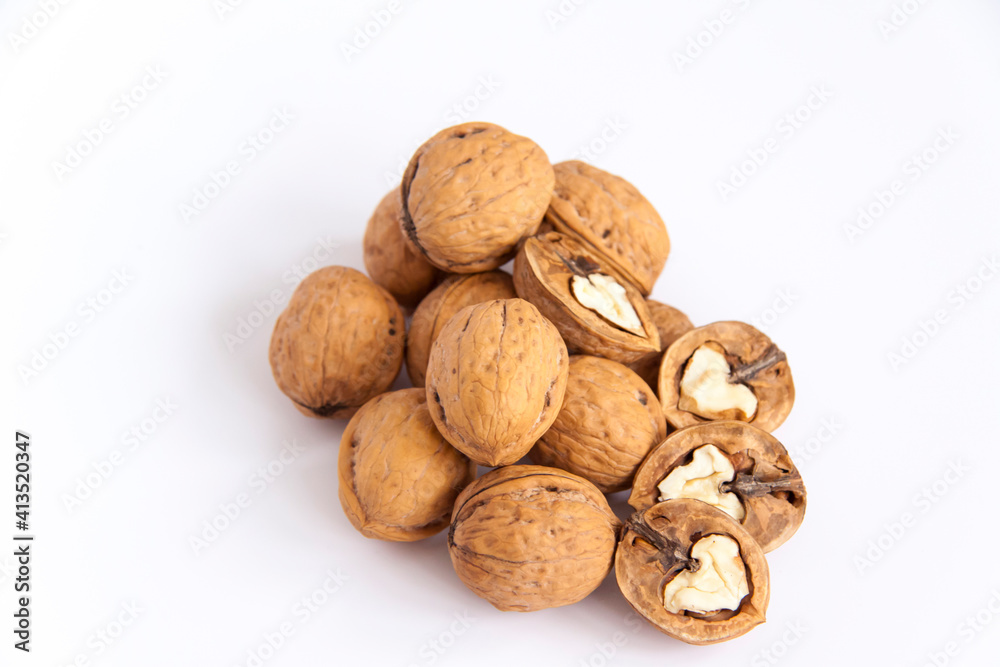 Walnuts in a shell on a white background. Healthy nuts. Walnuts in a shell on a white background. Healthy nuts.