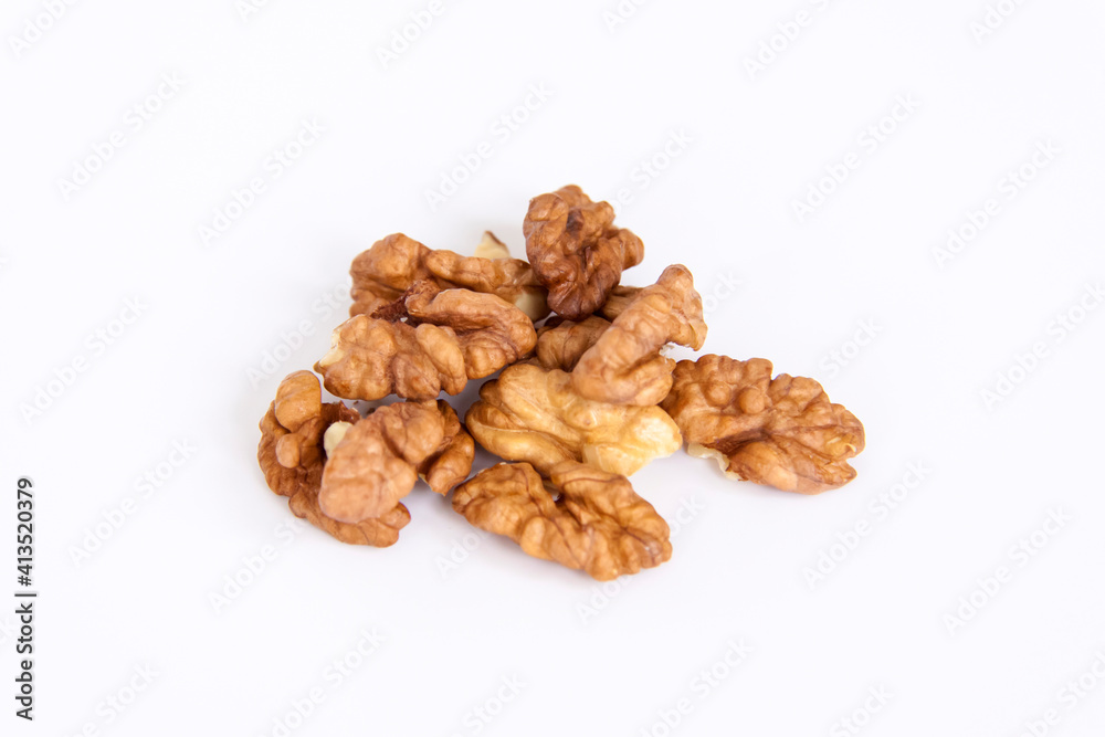 Walnuts without shells on a white background. Healthy nuts. Walnuts without shells on a white background. Healthy nuts.
