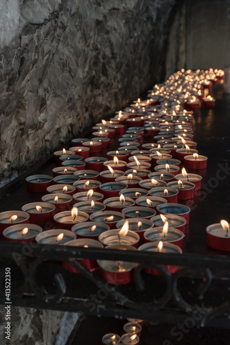 Fototapeta Naklejka Na Ścianę i Meble -  Candles lit in the church
