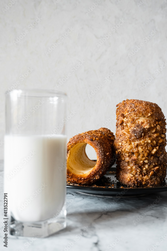 glass of milk and bakery with nuts and cinnamon. tdlo glass of milk and bakery with nuts and cinnamon. tdlo