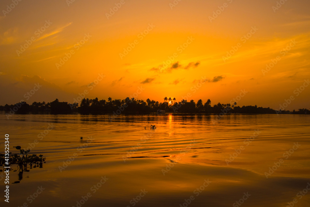 sunset on the lake in Kerala