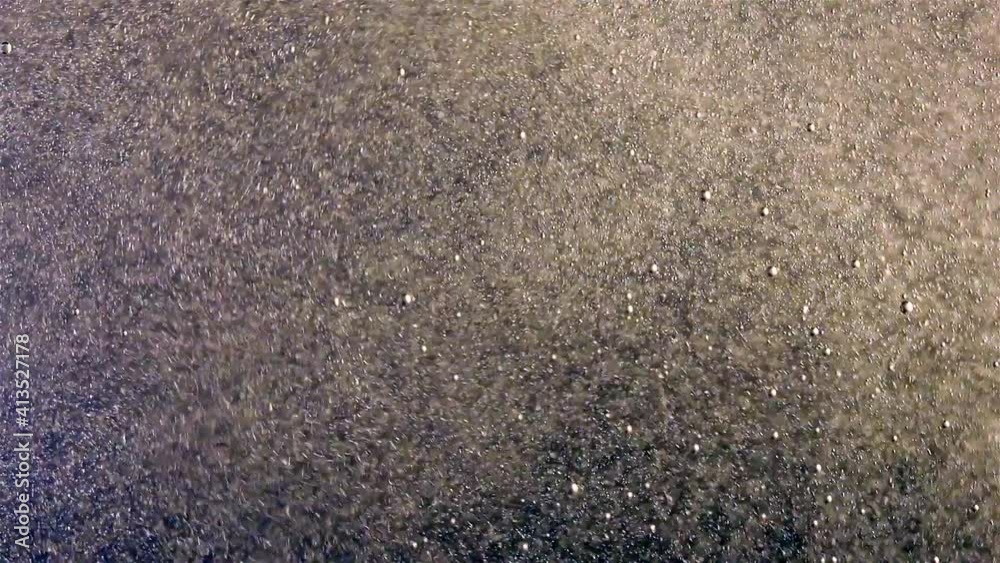 A bubbles rise upwards in water, close up. A bubbles rise upwards in water, close up.