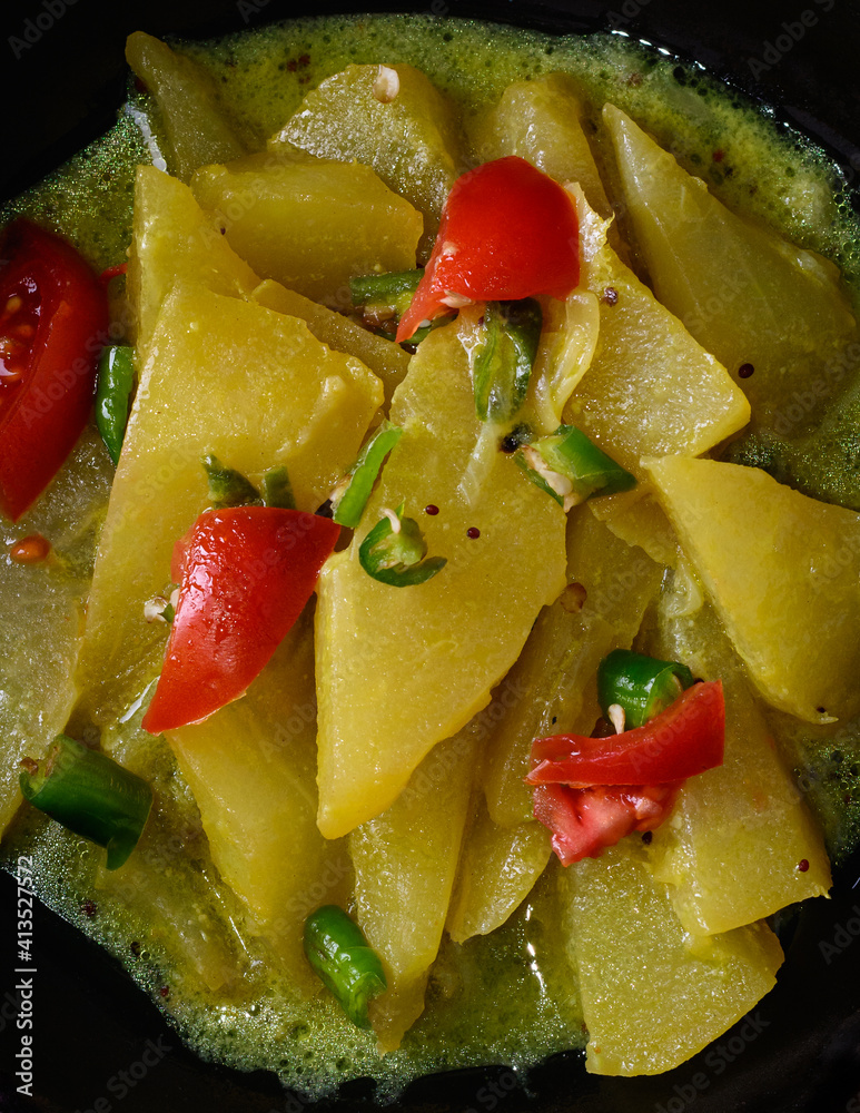 cooked chayote or chow chow in closeup, vegetarian dish on dark background, sri lankan vegetarian food cooked chayote or chow chow in closeup, vegetarian dish on dark background, sri lankan vegetarian food